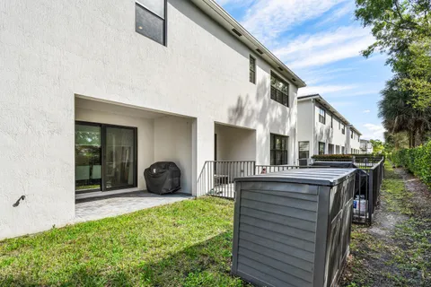 a view of a chair and tables in the patio