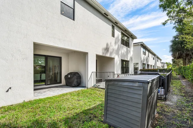 a view of a chair and tables in the patio