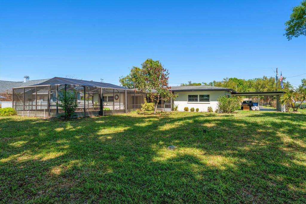 421 East County Line Road Lutz, FL 33549 - Photo 12 of 37 a front view of house with yard and green space
