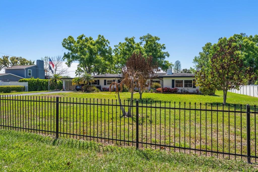 421 East County Line Road Lutz, FL 33549 - Photo 20 of 37 a view of a house with a fence