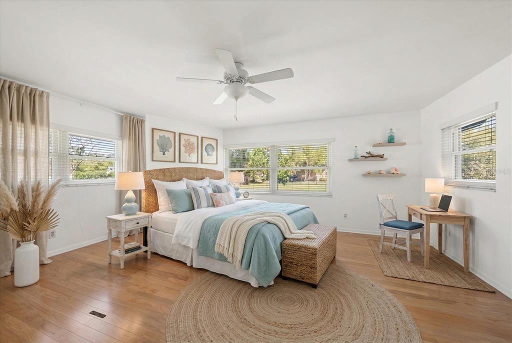 421 East County Line Road Lutz, FL 33549 - Photo 24 of 37 a spacious bedroom with a bed and a large window