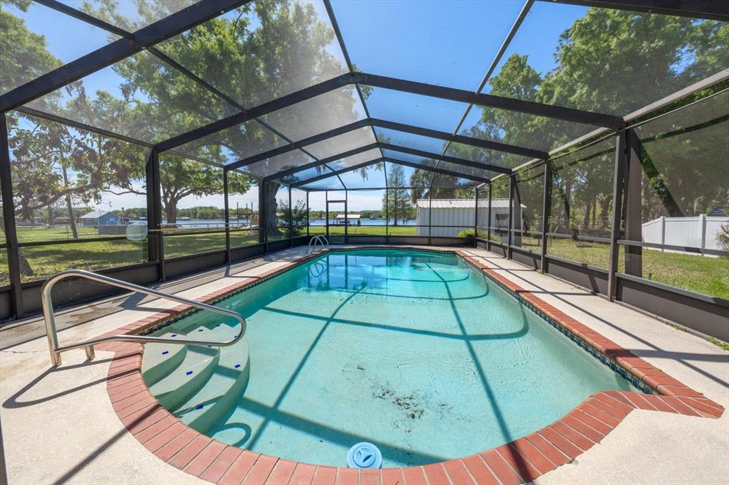 421 East County Line Road Lutz, FL 33549 - Photo 25 of 37 a view of a swimming pool with a patio