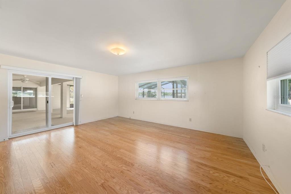 421 East County Line Road Lutz, FL 33549 - Photo 26 of 37 an empty room with wooden floor and windows