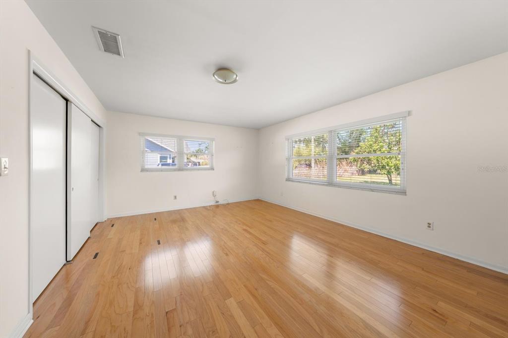 421 East County Line Road Lutz, FL 33549 - Photo 29 of 37 a view of empty room with wooden floor and fan