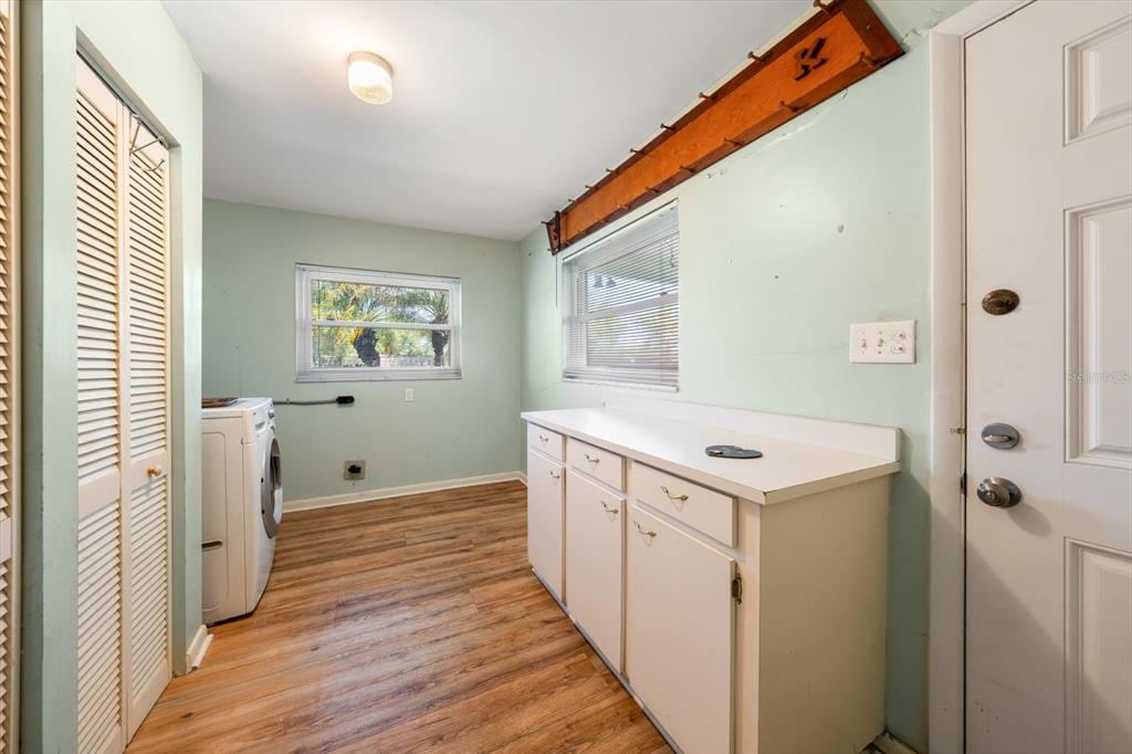 421 East County Line Road Lutz, FL 33549 - Photo 32 of 37 a view of a hallway with wooden floor and windows
