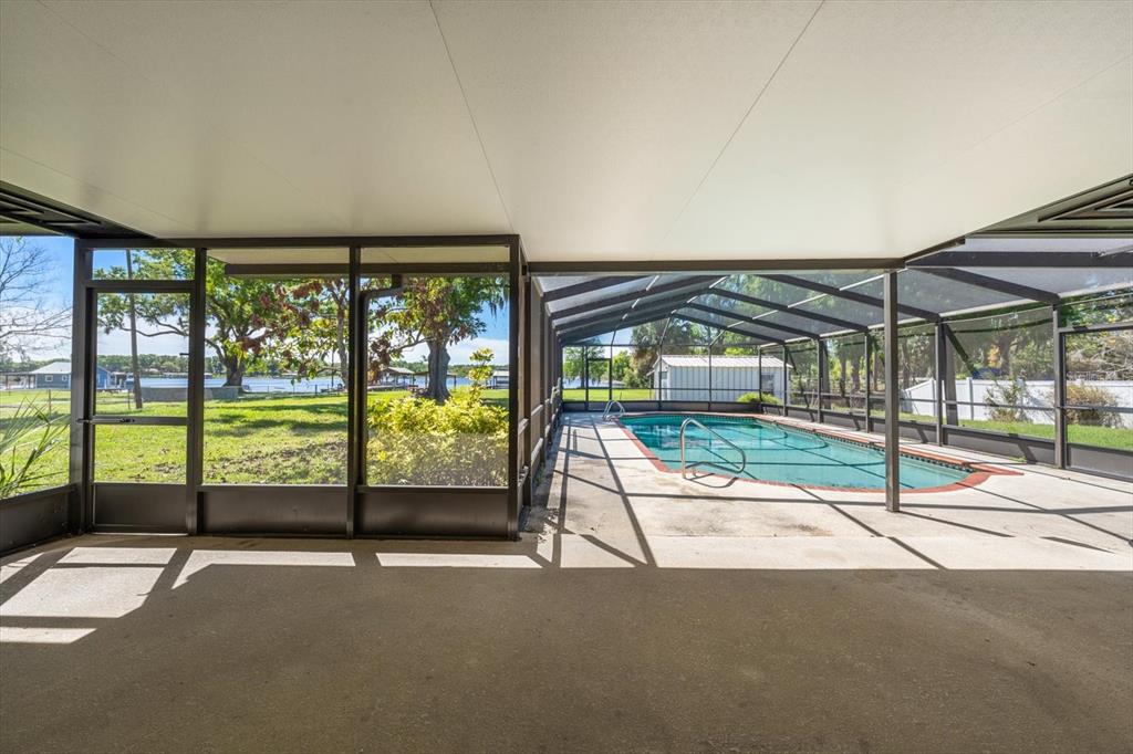 421 East County Line Road Lutz, FL 33549 - Photo 5 of 37 a view of swimming pool with an outdoor seating