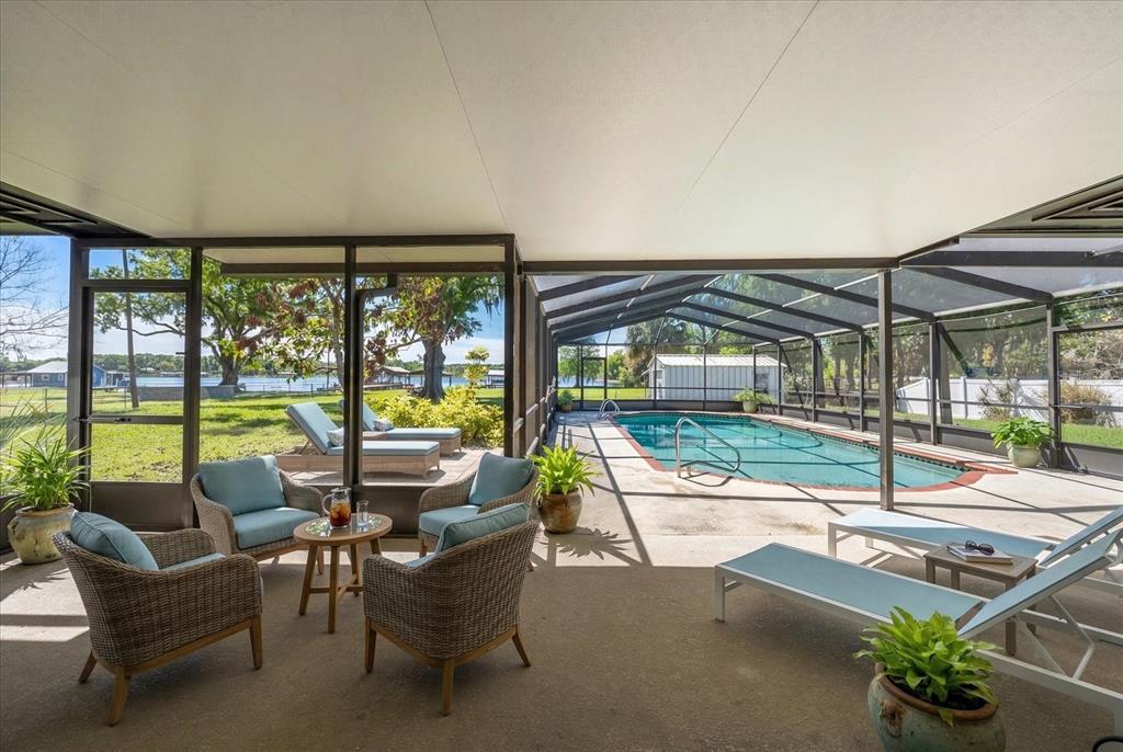 421 East County Line Road Lutz, FL 33549 - Photo 6 of 37 a building outdoor space with patio furniture and swimming pool