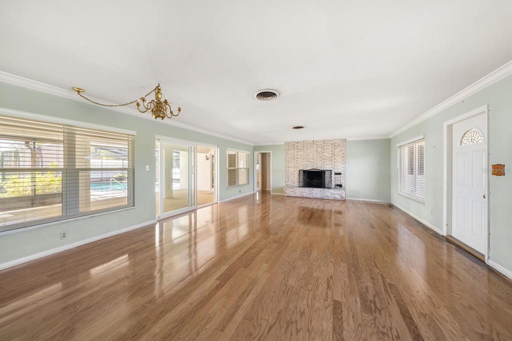 421 East County Line Road Lutz, FL 33549 - Photo 7 of 37 a big room with wooden floor and windows