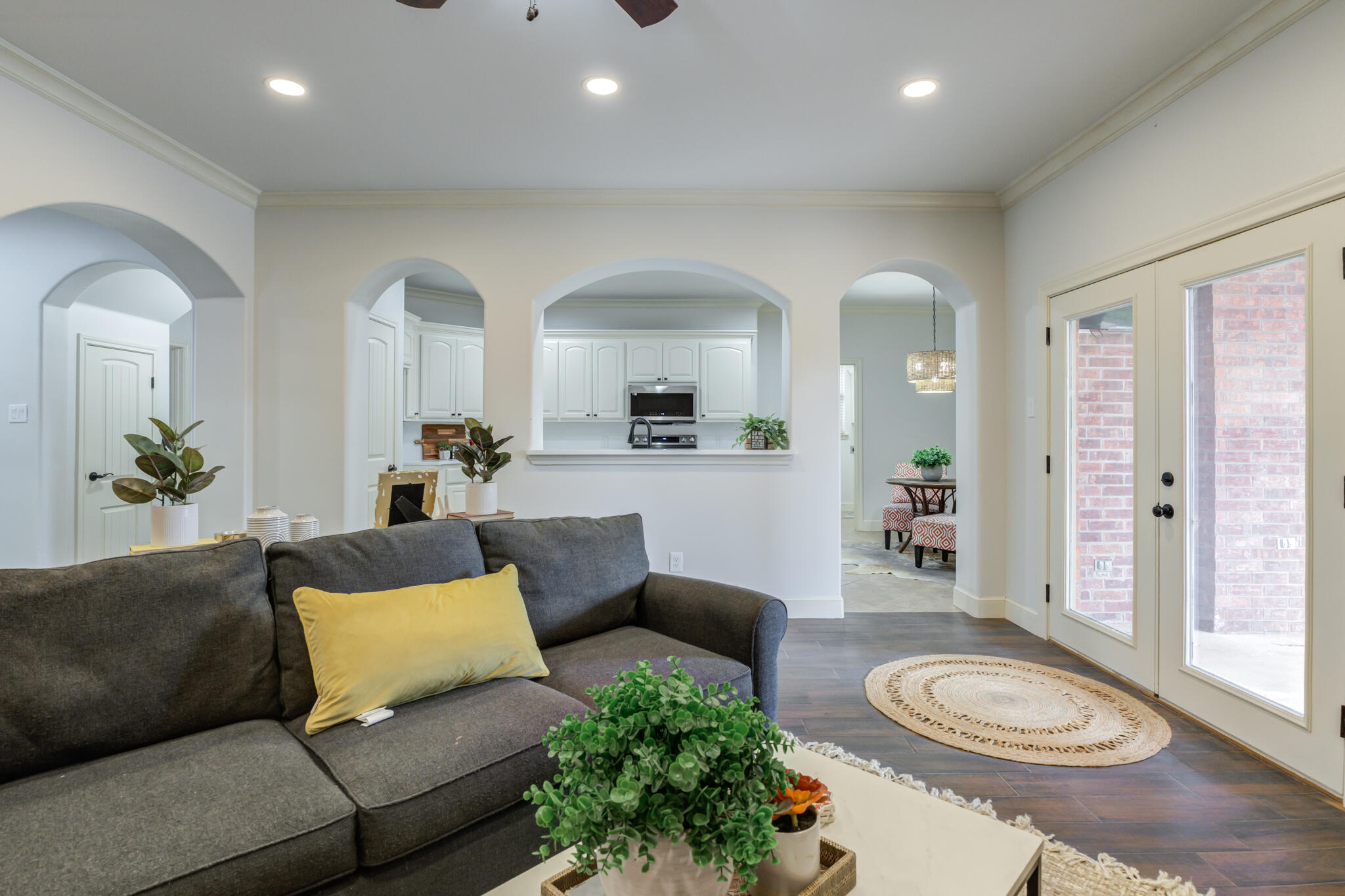 11110 Detroit Avenue Lubbock, TX 79423 - Photo 18 of 54 a living room with furniture a rug and a potted plant