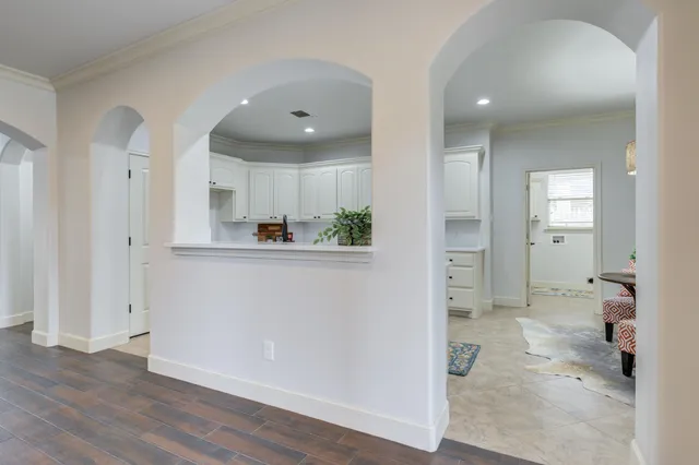 a kitchen with stainless steel appliances kitchen island granite countertop a sink and a microwave