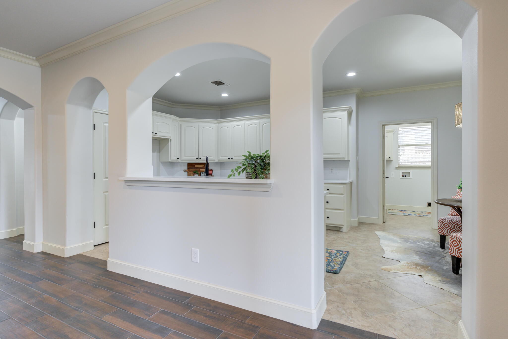 11110 Detroit Avenue Lubbock, TX 79423 - Photo 19 of 54 an empty room with wooden floor and a sink