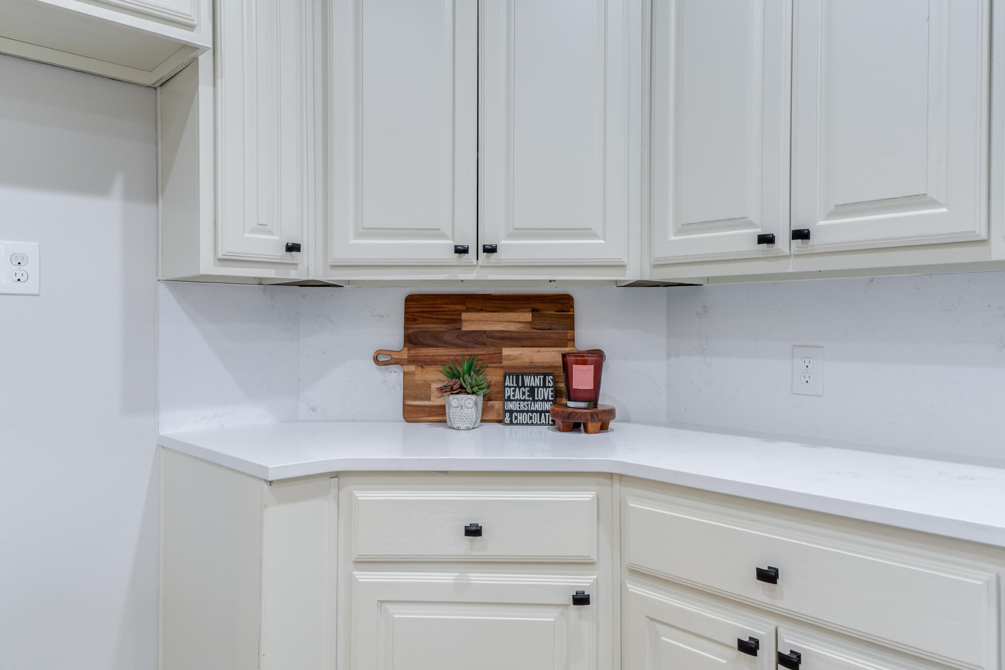 11110 Detroit Avenue Lubbock, TX 79423 - Photo 24 of 54 a kitchen with white cabinets and a refrigerator