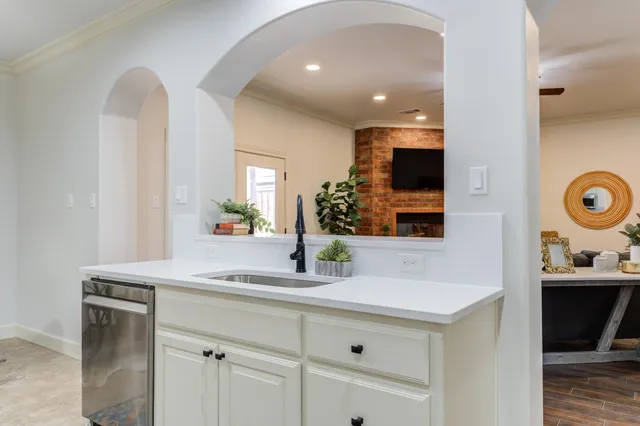 a bathroom with a window and a shower
