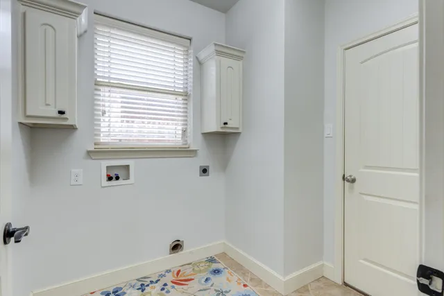 a living room with furniture a mirror and a table