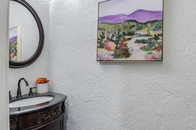 a view of an empty room with a chandelier