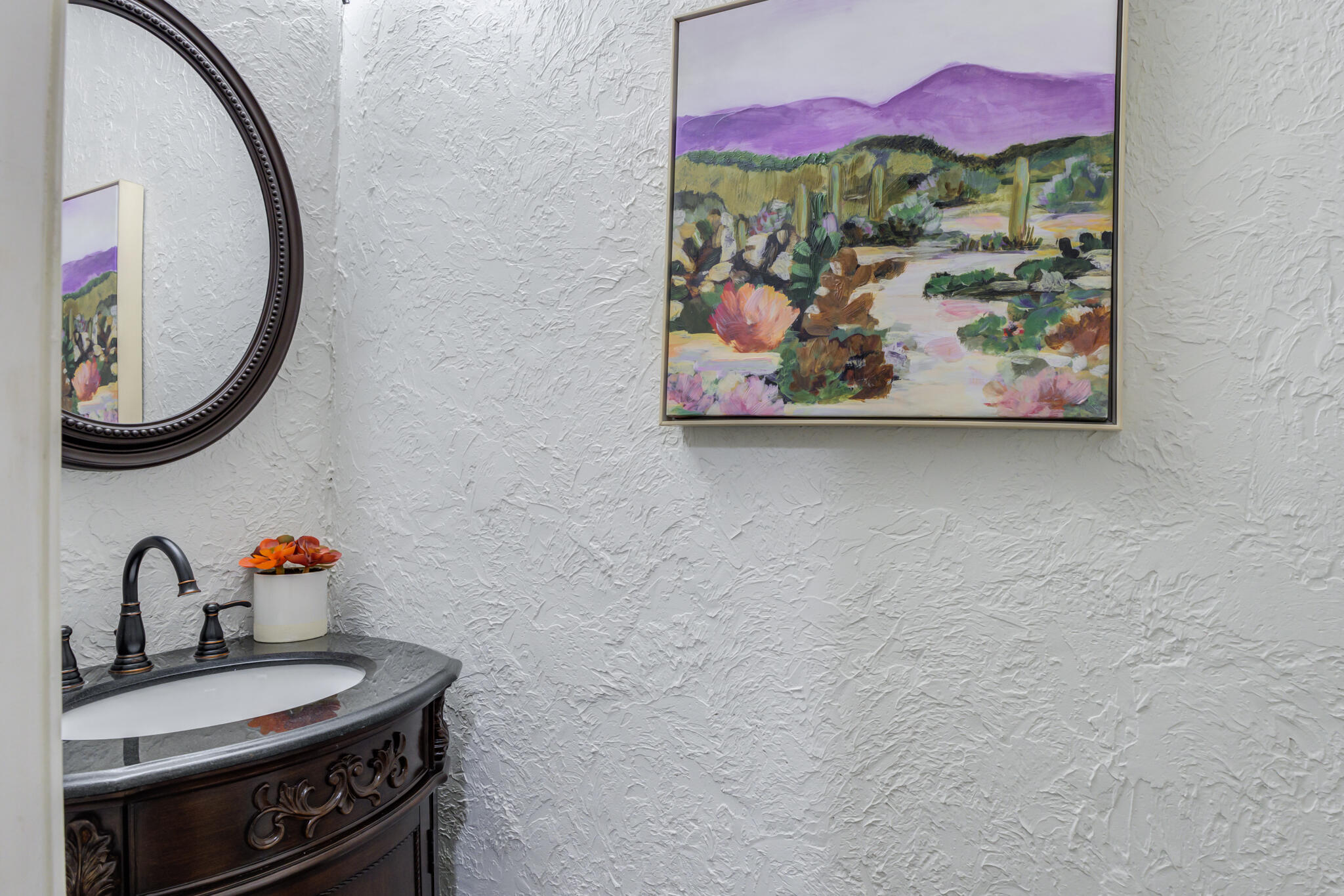 11110 Detroit Avenue Lubbock, TX 79423 - Photo 32 of 54 a bathroom with a sink and a mirror
