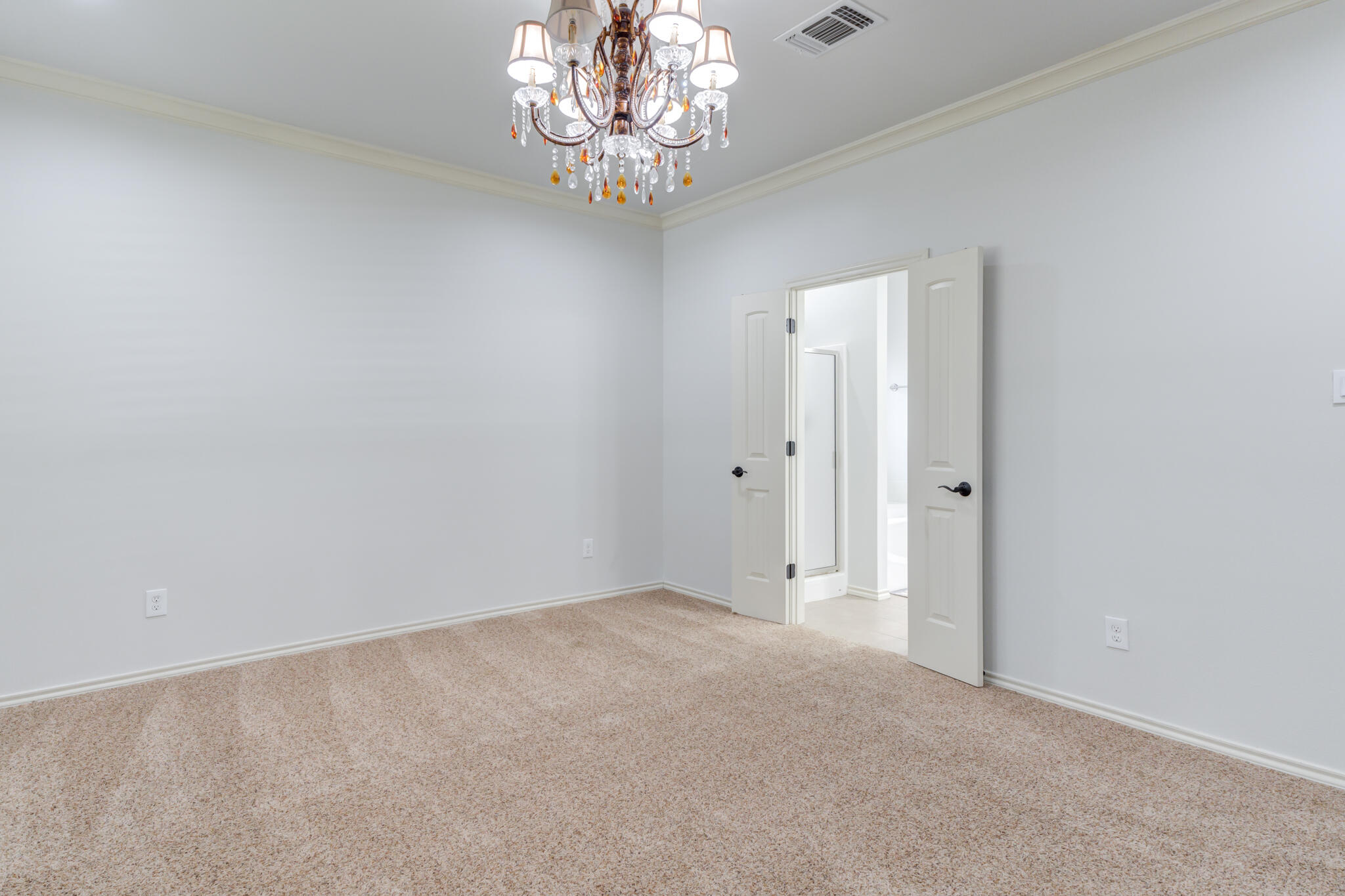 11110 Detroit Avenue Lubbock, TX 79423 - Photo 34 of 54 a view of an empty room with a chandelier