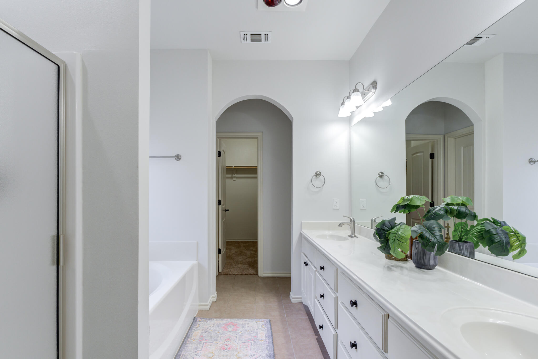 11110 Detroit Avenue Lubbock, TX 79423 - Photo 37 of 54 a bathroom with a sink and a mirror