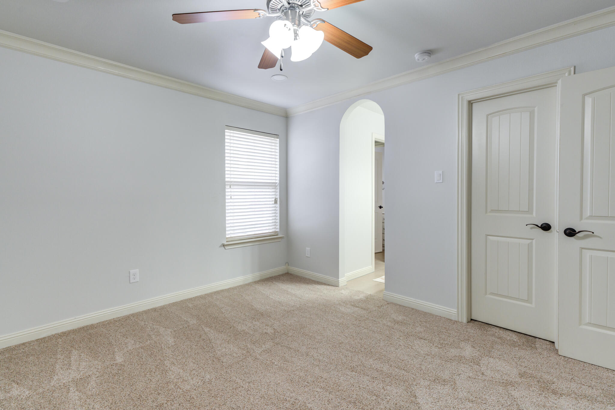 11110 Detroit Avenue Lubbock, TX 79423 - Photo 41 of 54 an empty room with chandelier fan and windows
