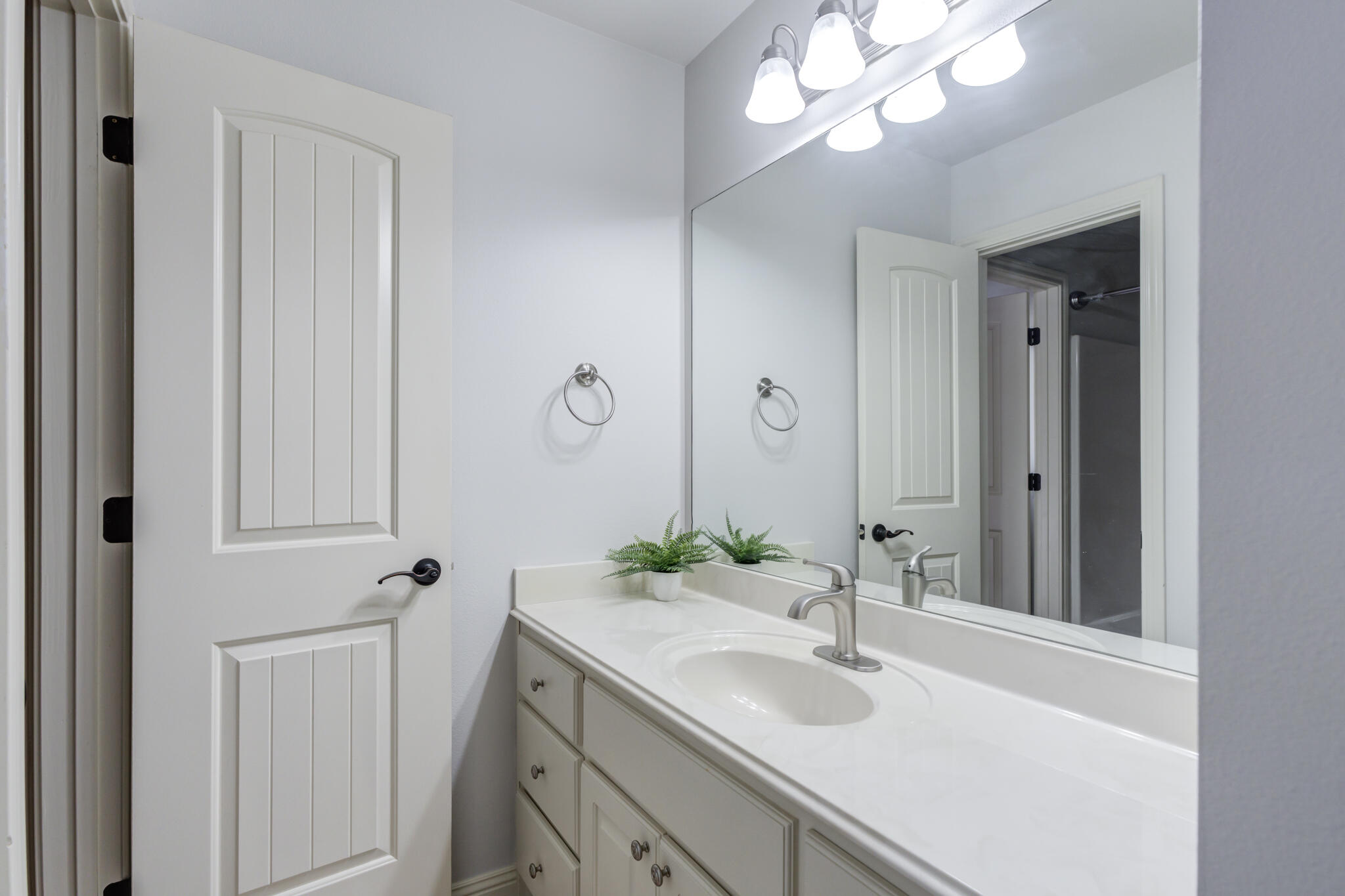 11110 Detroit Avenue Lubbock, TX 79423 - Photo 42 of 54 a bathroom with a sink and a mirror