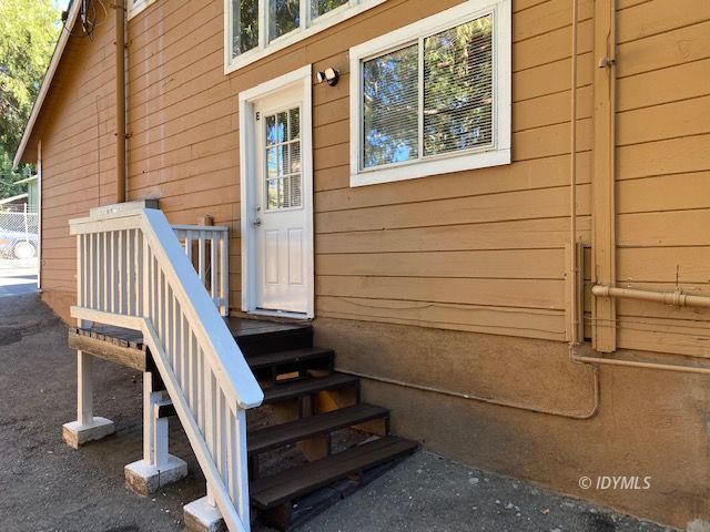 a view of entryway with a wooden door