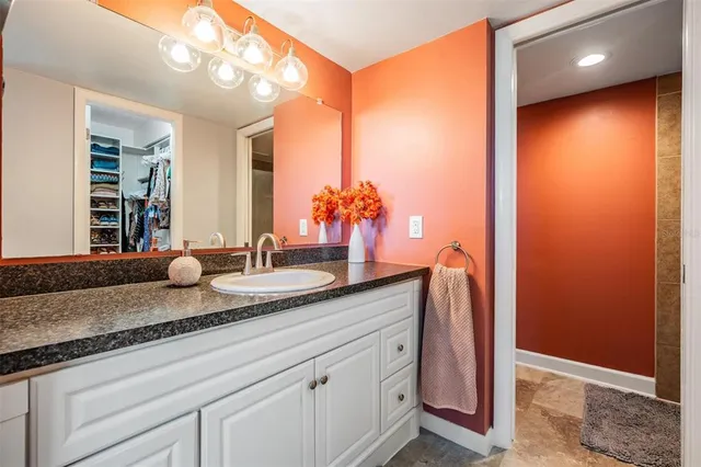 a bathroom with a double vanity sink and a mirror
