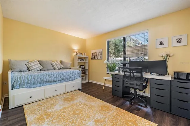 a bedroom with a bed and with furniture