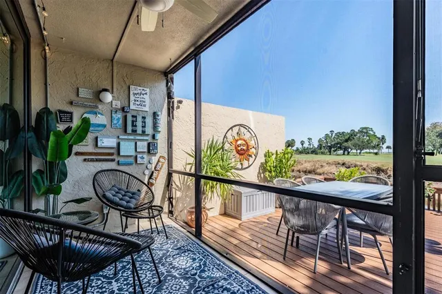 a view of a room with furniture wooden floor and window