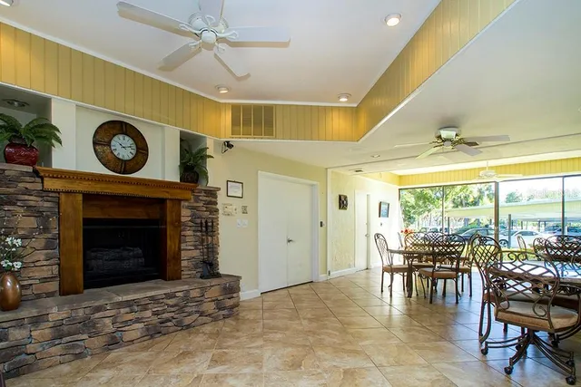 a living room with furniture and a dining table