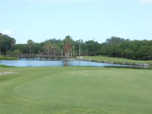 a table with chairs and couches in a patio