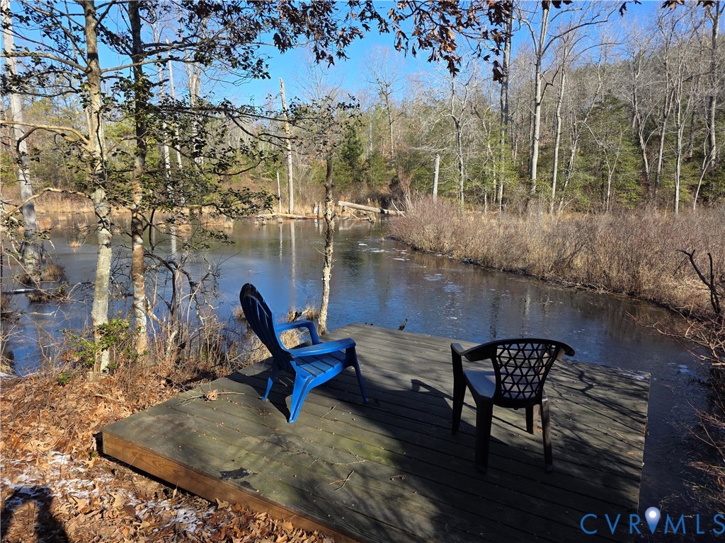 1585 Ullainee Road Caret, VA 22436 - Photo 2 of 10 a view of a lake from a roof deck