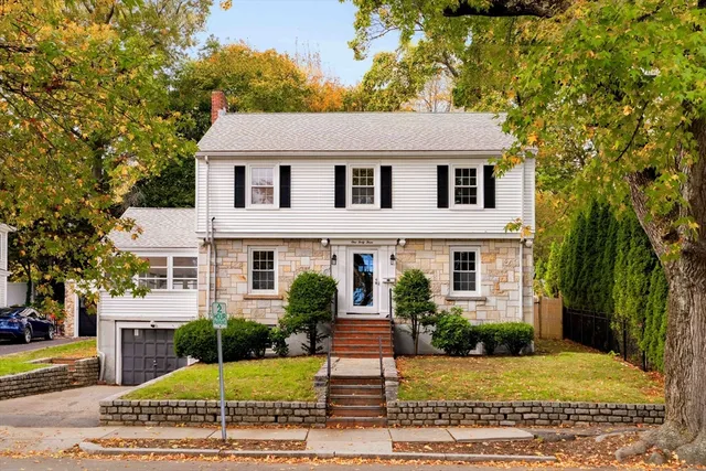 a front view of a house with garden