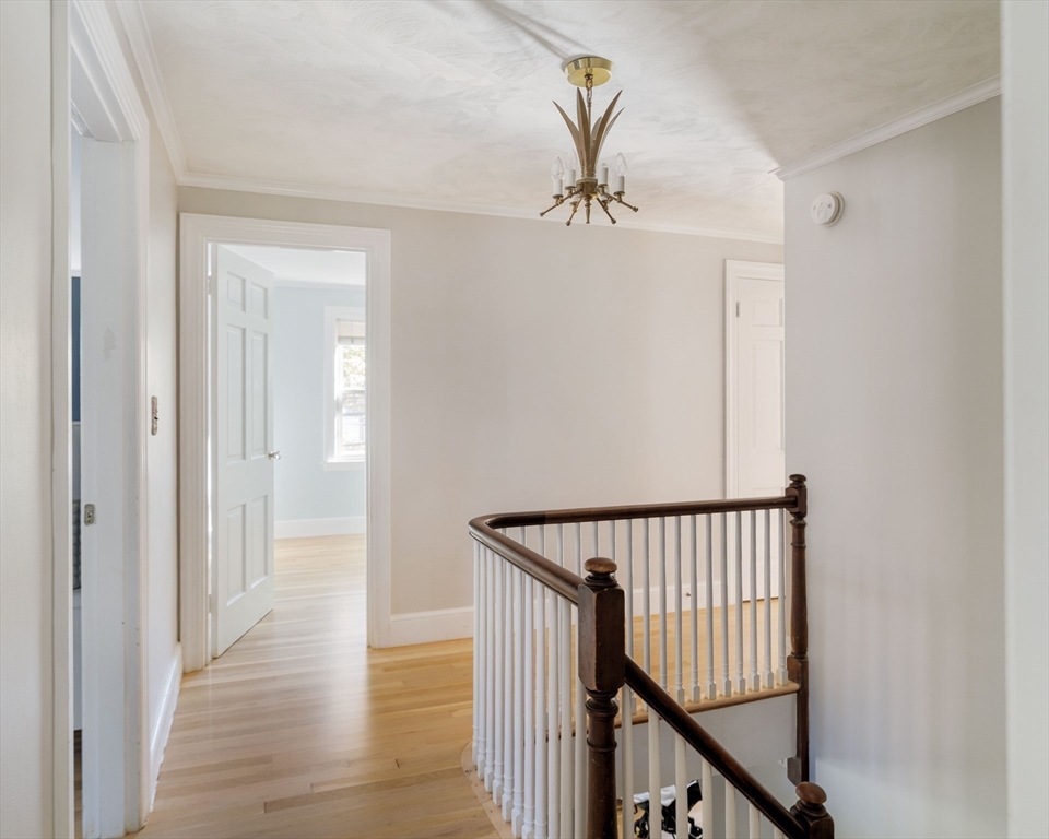 143 South Street Brookline, MA 02467 - Photo 16 of 32 a view of a hallway with wooden floor and staircase