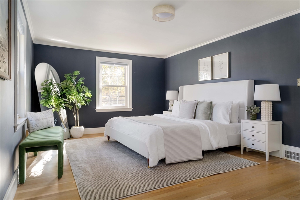 143 South Street Brookline, MA 02467 - Photo 18 of 32 a bedroom with bed and a couch