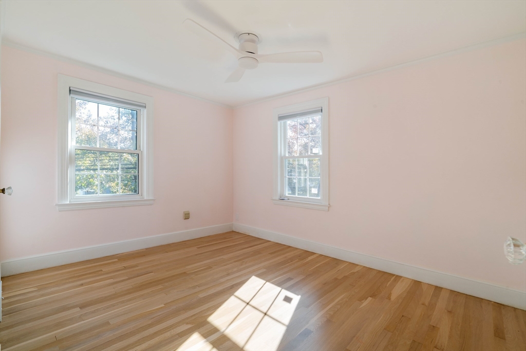 143 South Street Brookline, MA 02467 - Photo 28 of 32 a view of empty room with wooden floor and fan
