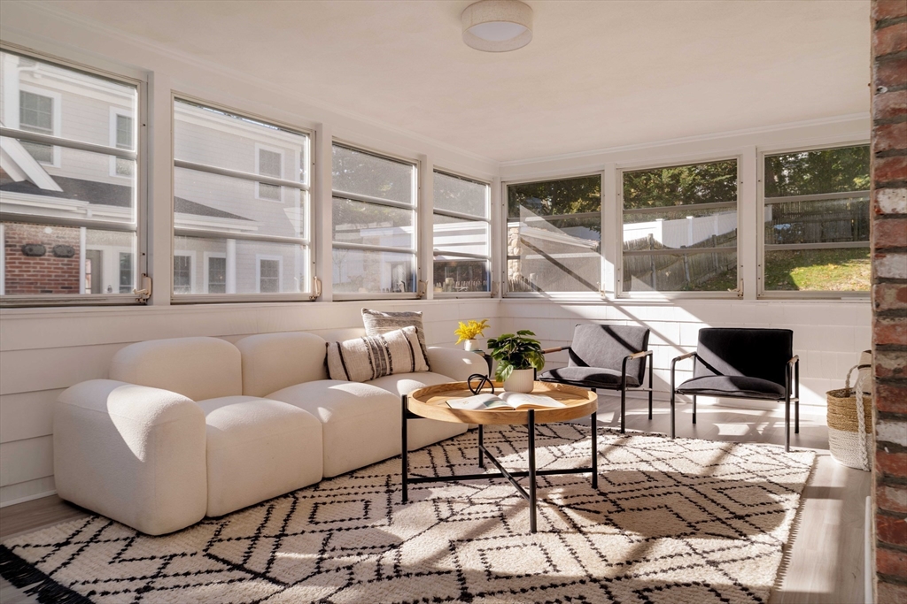 143 South Street Brookline, MA 02467 - Photo 29 of 32 a living room with furniture and large windows