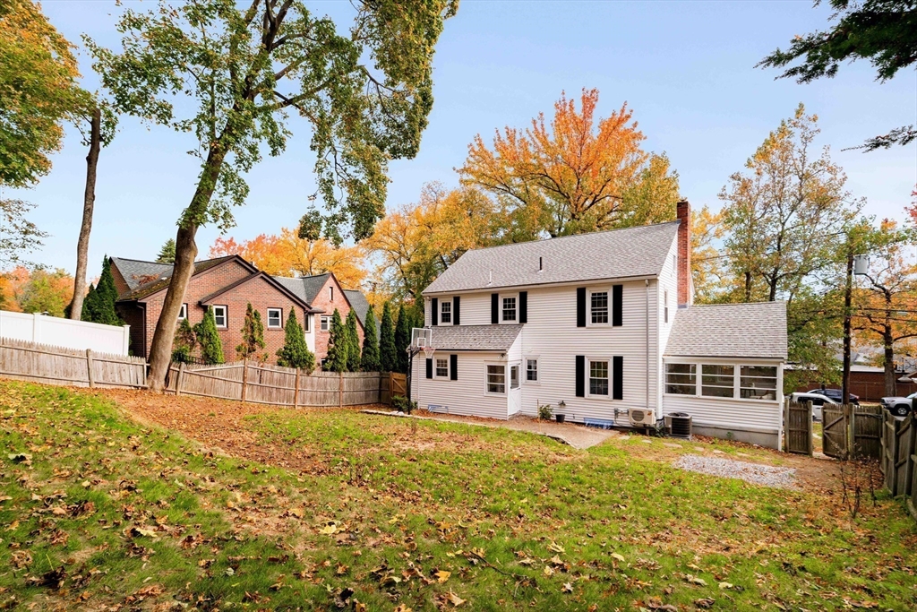143 South Street Brookline, MA 02467 - Photo 32 of 32 a front view of a house with a yard covered with snow and trees