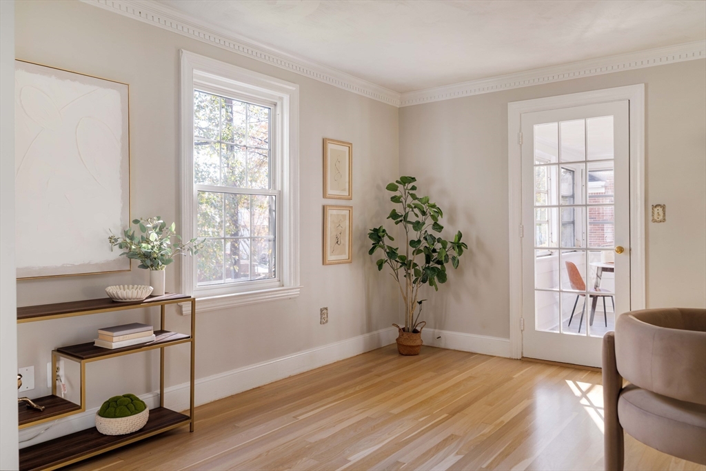143 South Street Brookline, MA 02467 - Photo 9 of 32 an empty room with wooden floor and windows
