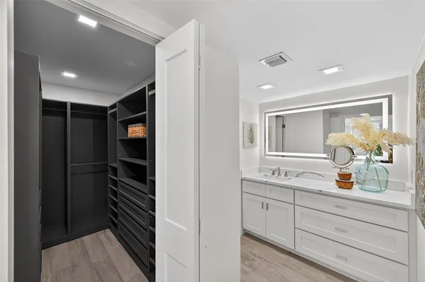 a shelf with dining room and wooden floor
