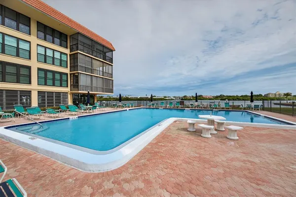 a view of swimming pool with outdoor seating
