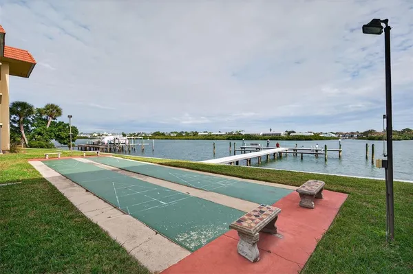 a view of a swimming pool with a lawn chairs