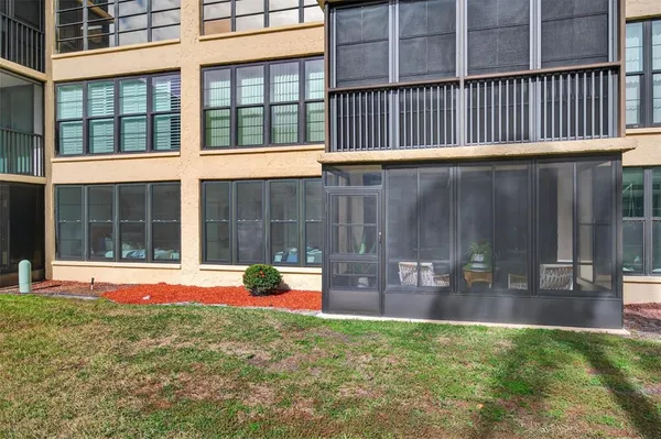 a view of a large building with a yard