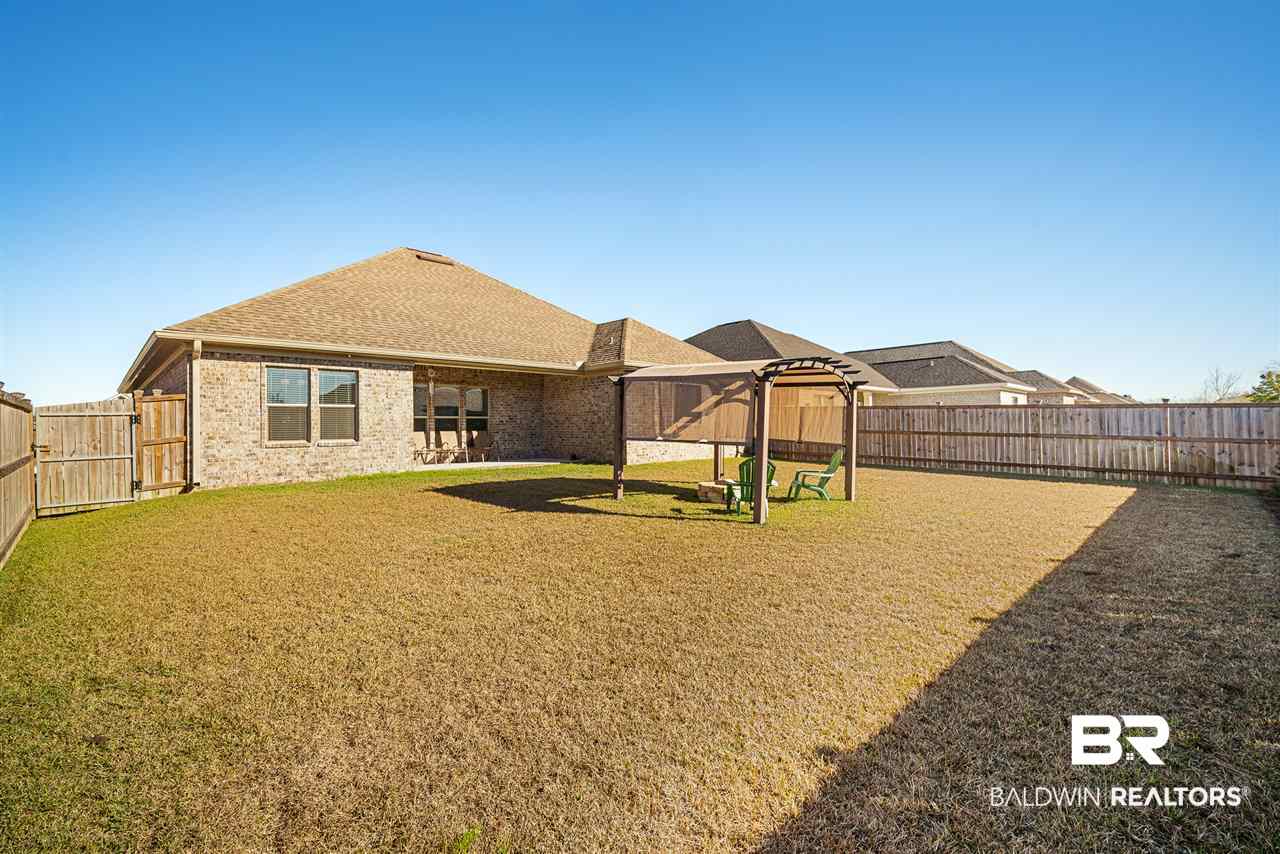 8687 Rosedown Lane Daphne, AL 36526 - Photo 23 of 27 Pergola & Fire pit