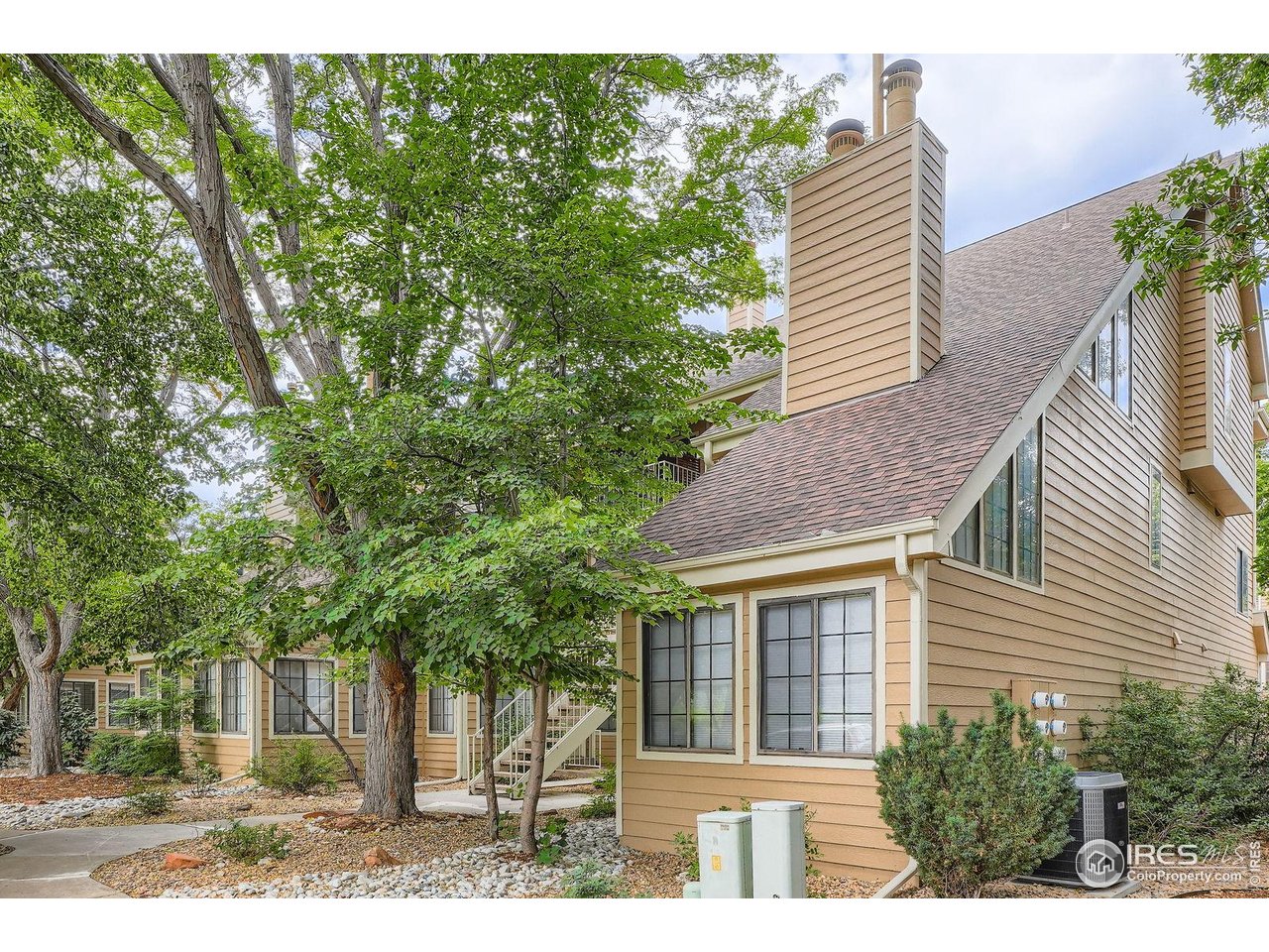 4767 White Rock Circle, Unit D Boulder, CO 80301 - Photo 1 of 41 a view of a house with a yard and potted plants