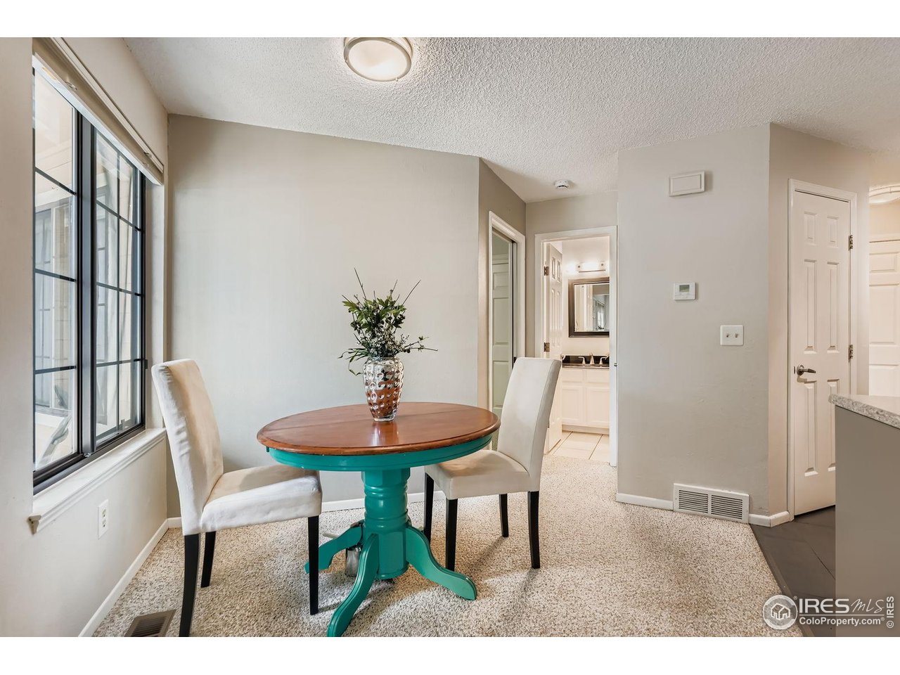 4767 White Rock Circle, Unit D Boulder, CO 80301 - Photo 13 of 41 a dining room with furniture and window