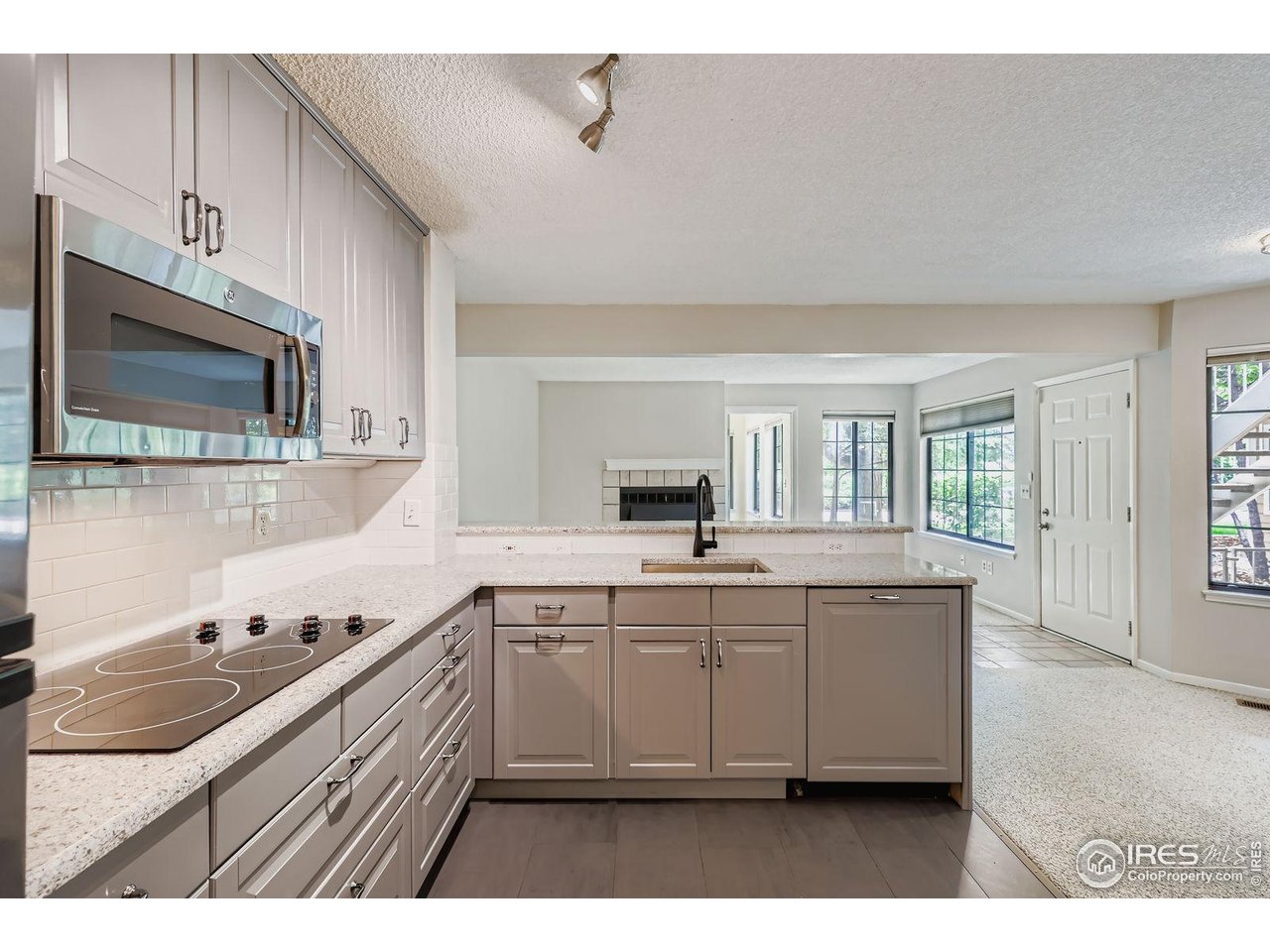 4767 White Rock Circle, Unit D Boulder, CO 80301 - Photo 16 of 41 a kitchen with a sink and cabinets