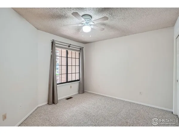 a view of empty room with windows