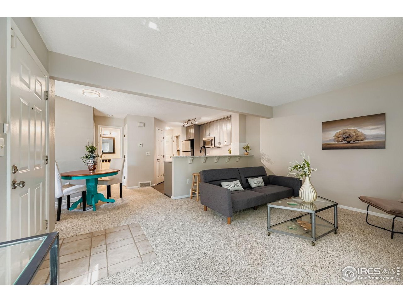 4767 White Rock Circle, Unit D Boulder, CO 80301 - Photo 9 of 41 a living room with furniture and a dining table with kitchen view