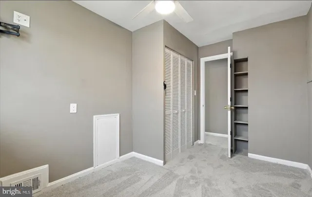 an empty room with closet