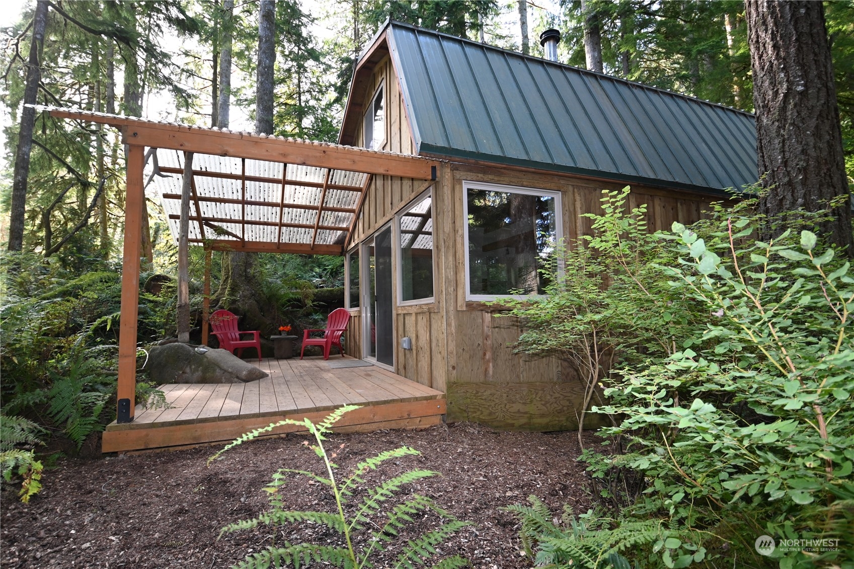 52016 South Riverside Road Gold Bar, WA 98251 - Photo 2 of 39 a view of a house with backyard and sitting area